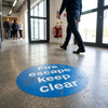 Fire Escape Floor Graphic Sign – 400mm Diameter – Polycarbonate – Industrial